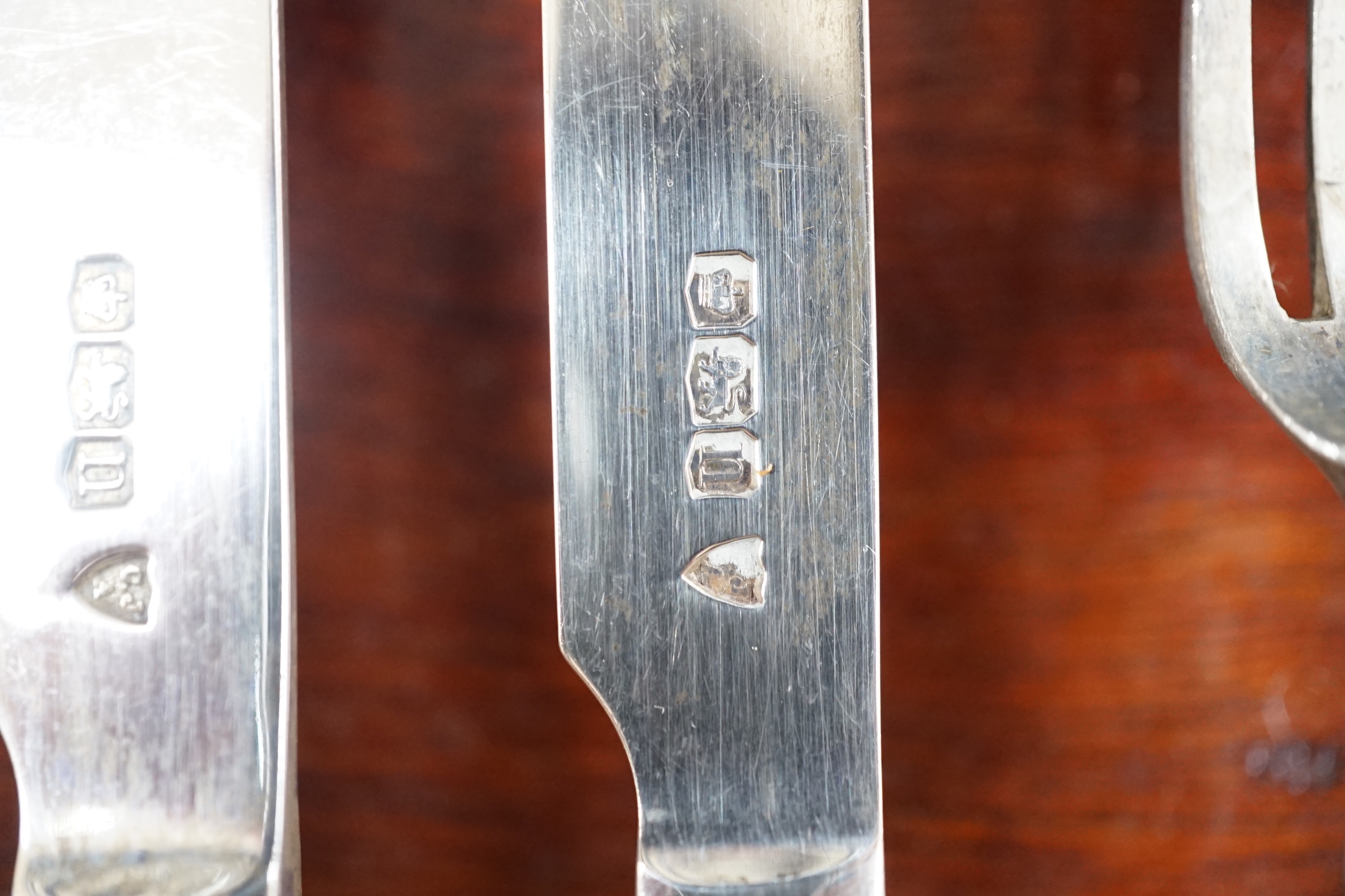 A Thai white metal cigarette box, stamped sterling, 14cm, and a similar sterling overlaid photograph frame, width 16cm